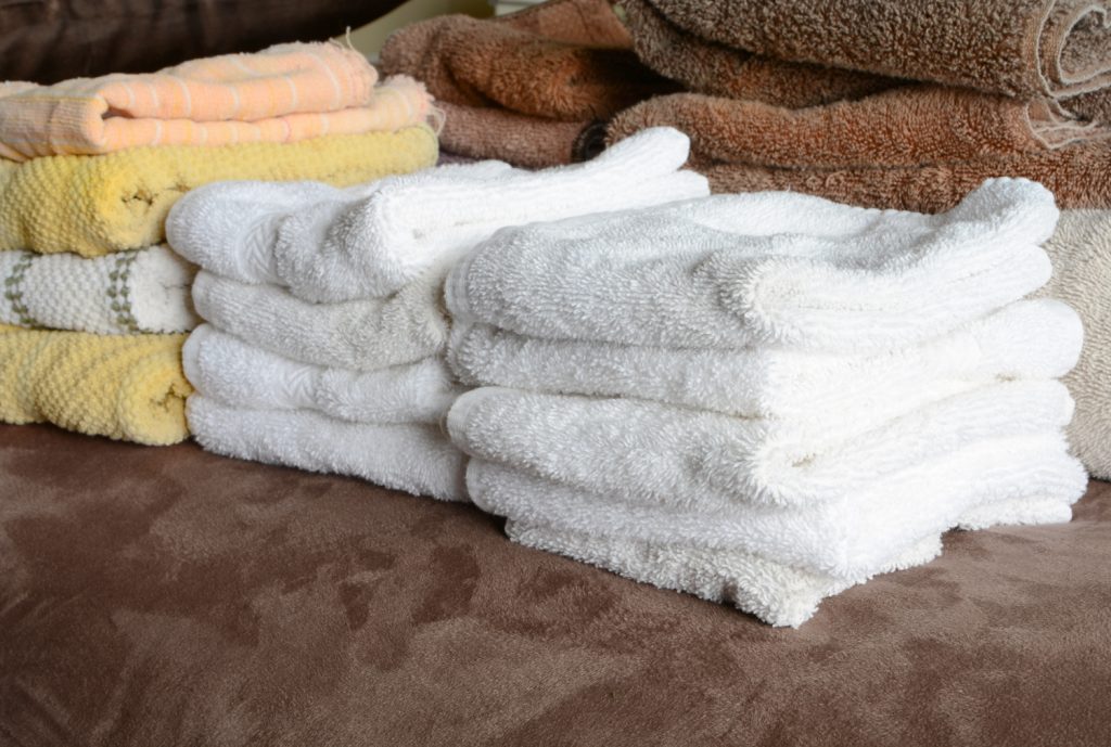 stacks of towels sorted by colors