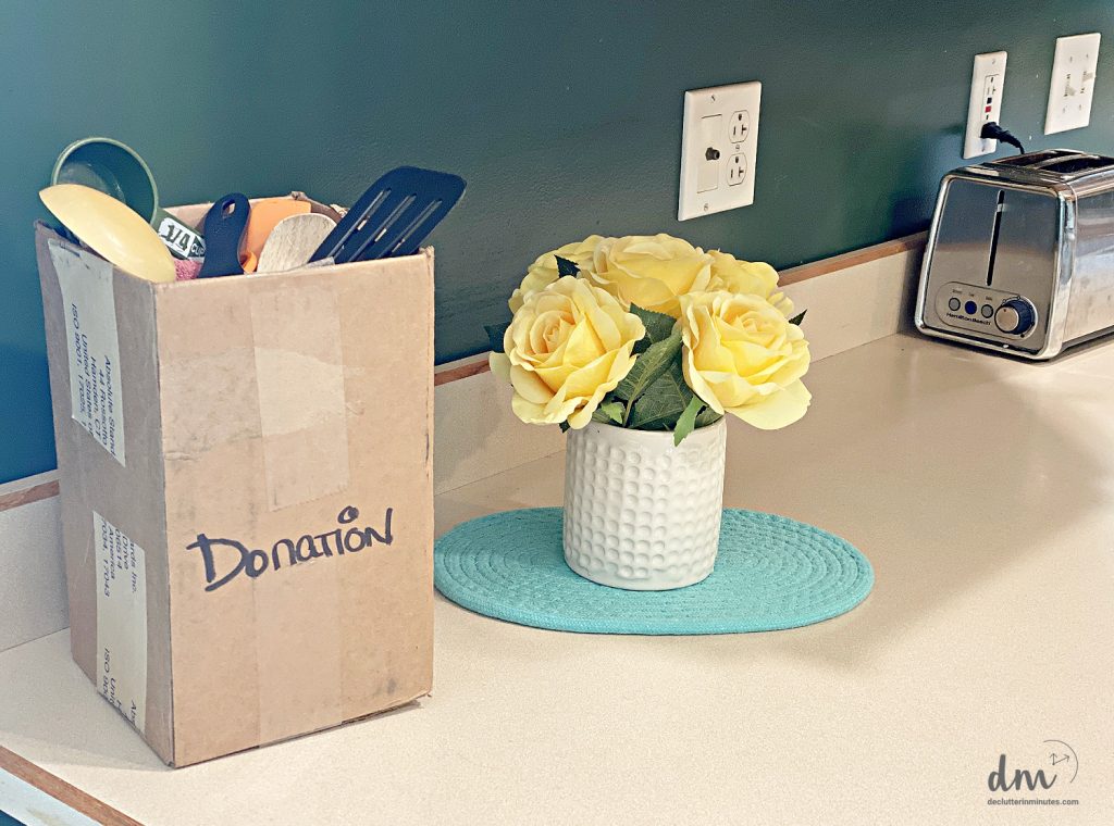 a donation box sitting on a counter in a kitchen